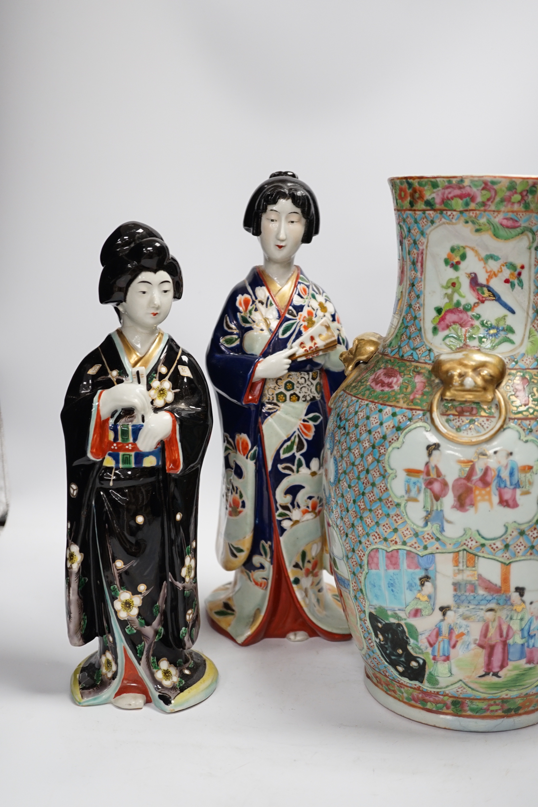 Two Japanese figures wearing kimonos, early 20th century and a 19th century Chinese famille rose vase, largest 34cm high